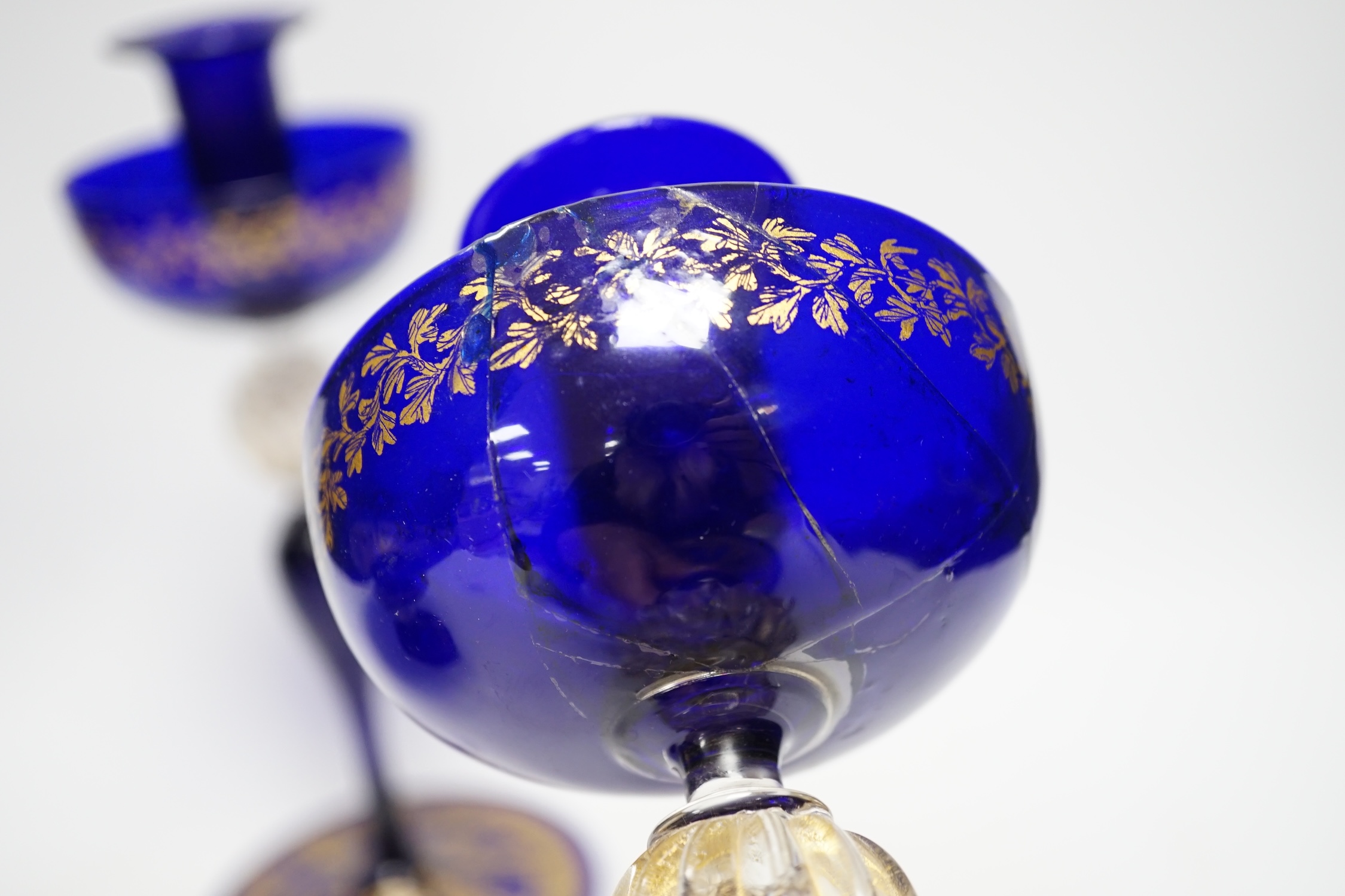 A Venetian gilded glass pedestal dish and a pair of candle holders, 26cm